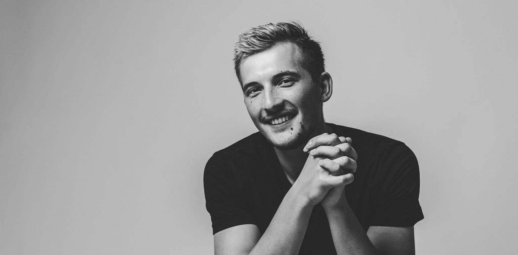 Black-and-white portrait of Oleksandr, founder and photographer at Oleks Digital Production